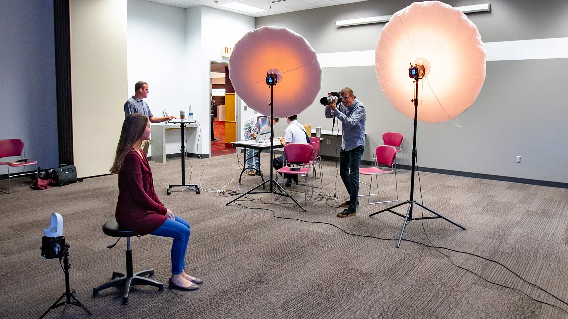 Missouri State University employee having photo taken during free staff and faculty portrait days event.