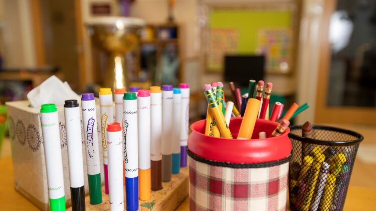 Markers, pencils and crayons in an early childhood classroom.