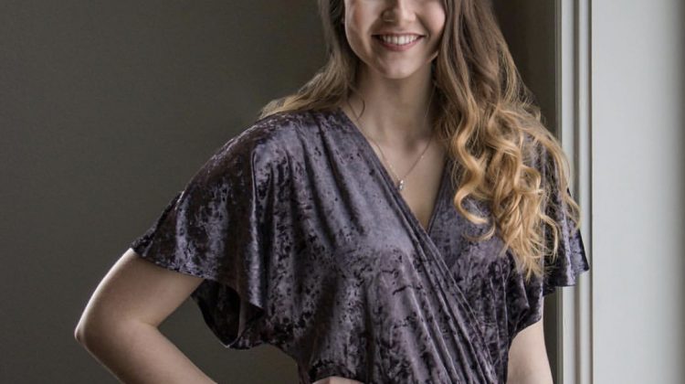 Professional Portrait of female age 23 wearing a purple velvety dress