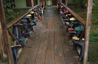Galoshes await students at the rain forest campus.