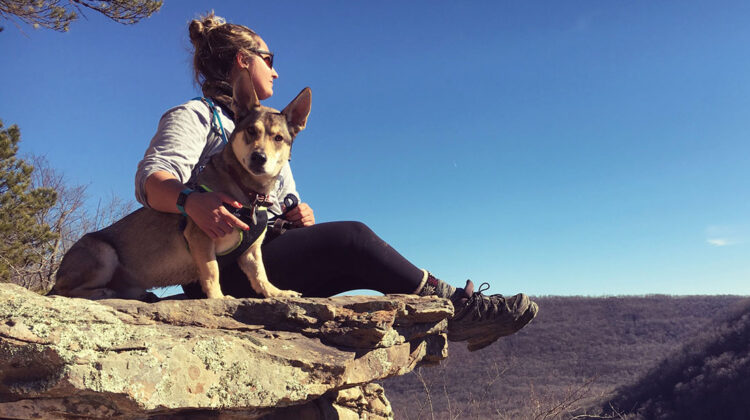 Sage with her dog on a rock