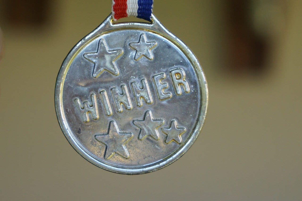 An award medallion labeled "winner."