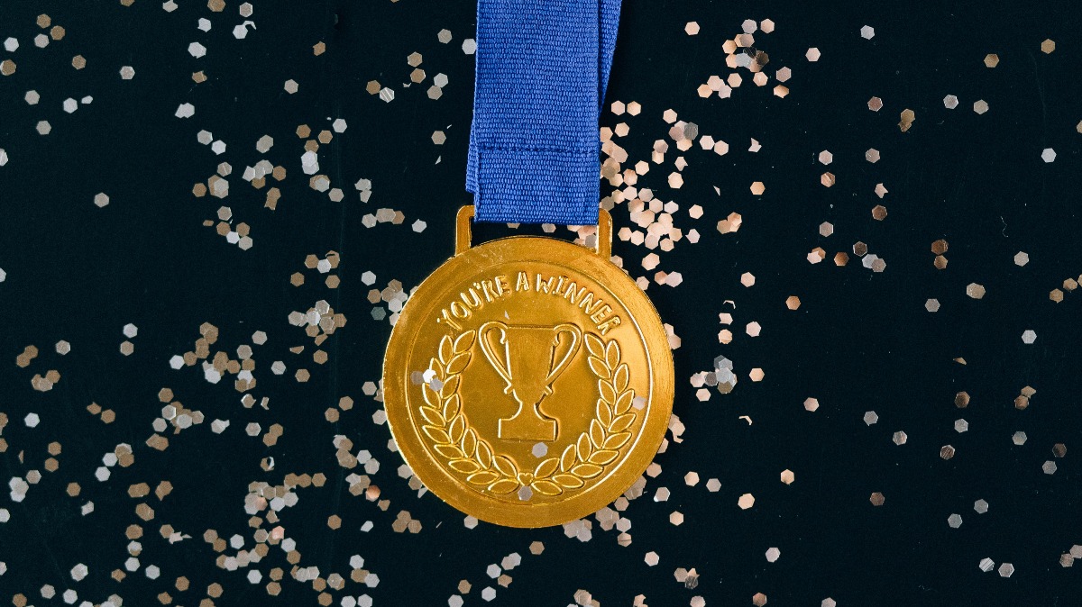 An award medal with the label "Winner." Photo by Nataliya Vaitkevich from Pexels.