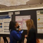 Rita Afagwu (left) and her research at the conference.