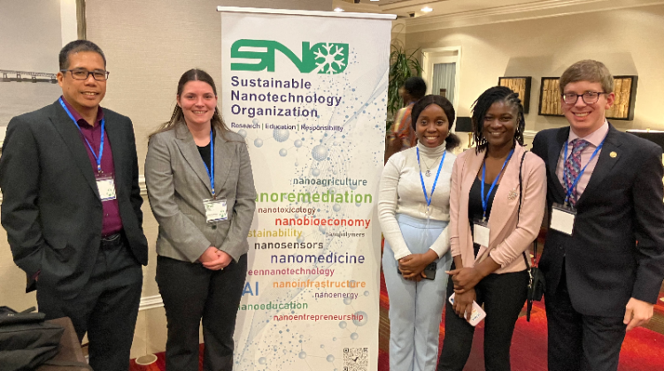 Dr. Cyren Rico, Riley Pope-Buss, Blessing Akinwande, Mary Fakunle and Preston Clubb in front of a SNO conference poster.