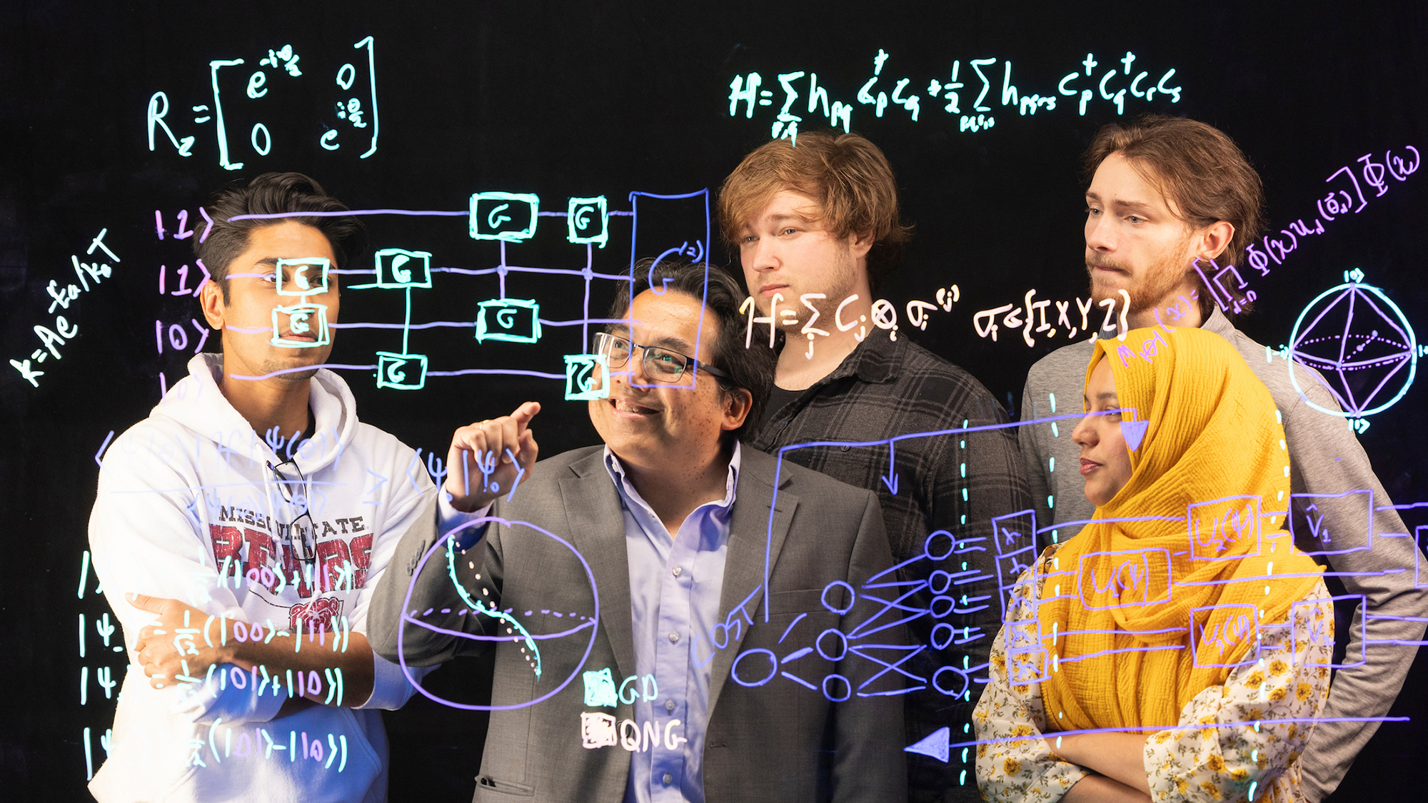 Dr. Ridwan Sakidja (center), Missouri State University professor of physics, astronomy and materials science, with students from his research group (including Gaige Riggs on his right), spearhead a project on quantum circuit designs.