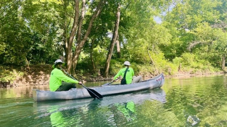 Kaiser Mostafiz (left) and one other person conducting research for OEWRI in a boat on the James River.