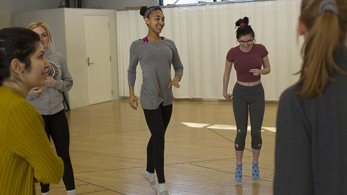 Students dancing in a voice and movement class