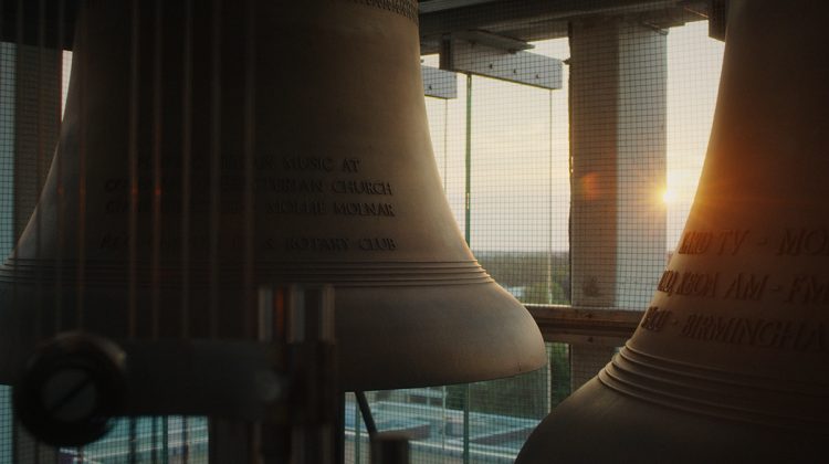Sun rising behind the Missouri State Carillon bells