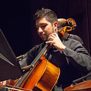 Orchestra student plays cello at MSU