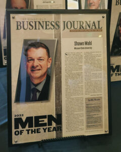 A framed article of Wahl's SBJ Men of the Year announcement