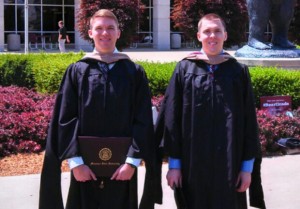 Collin and Colby Geringer stand outside after graduation