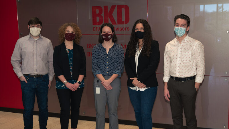 Five students with face masks on.