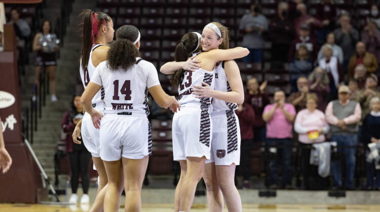 Abby Hipp embraces teammate at her last game as a Lady Bear.