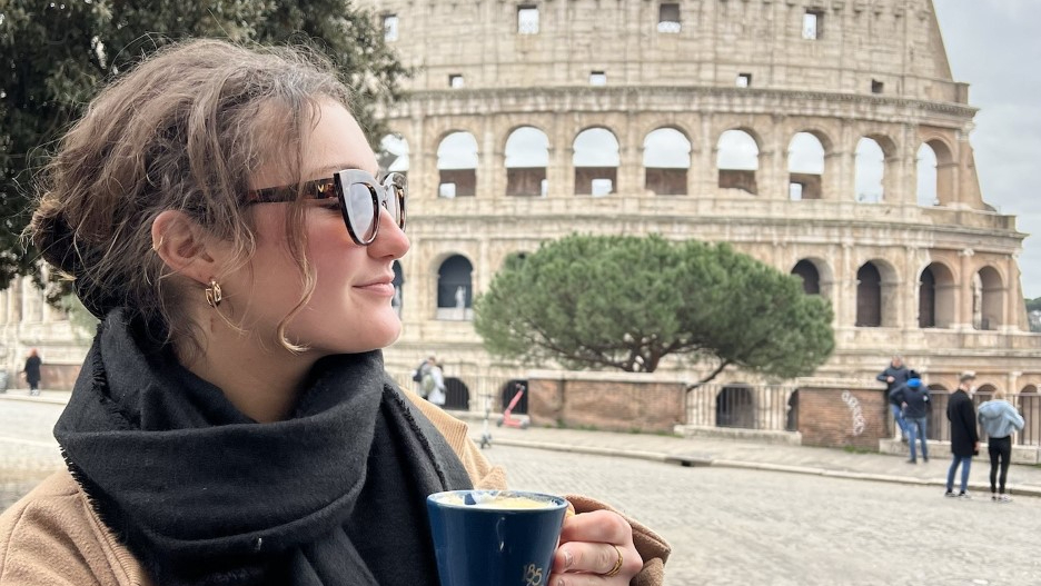 Rhea Rechav in front of the Colosseum.