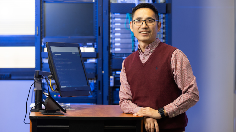 Dr. Lawrence Yang in computer lab.