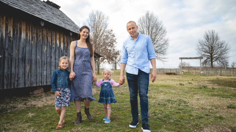 Michael Owens with wife and two daughters on a farm in early autumn.