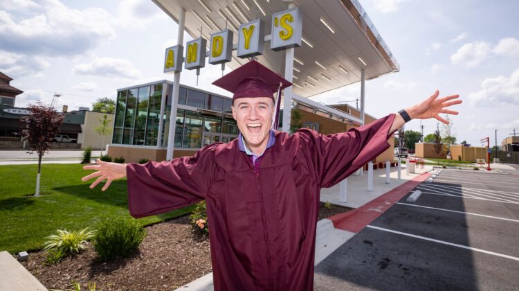 Travis King poses in front of Andy's frozen custard near the MSU campus