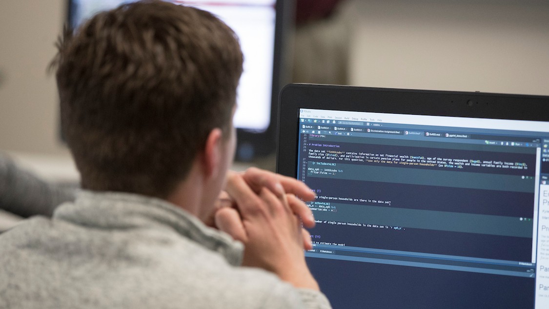 A student working at a computer.