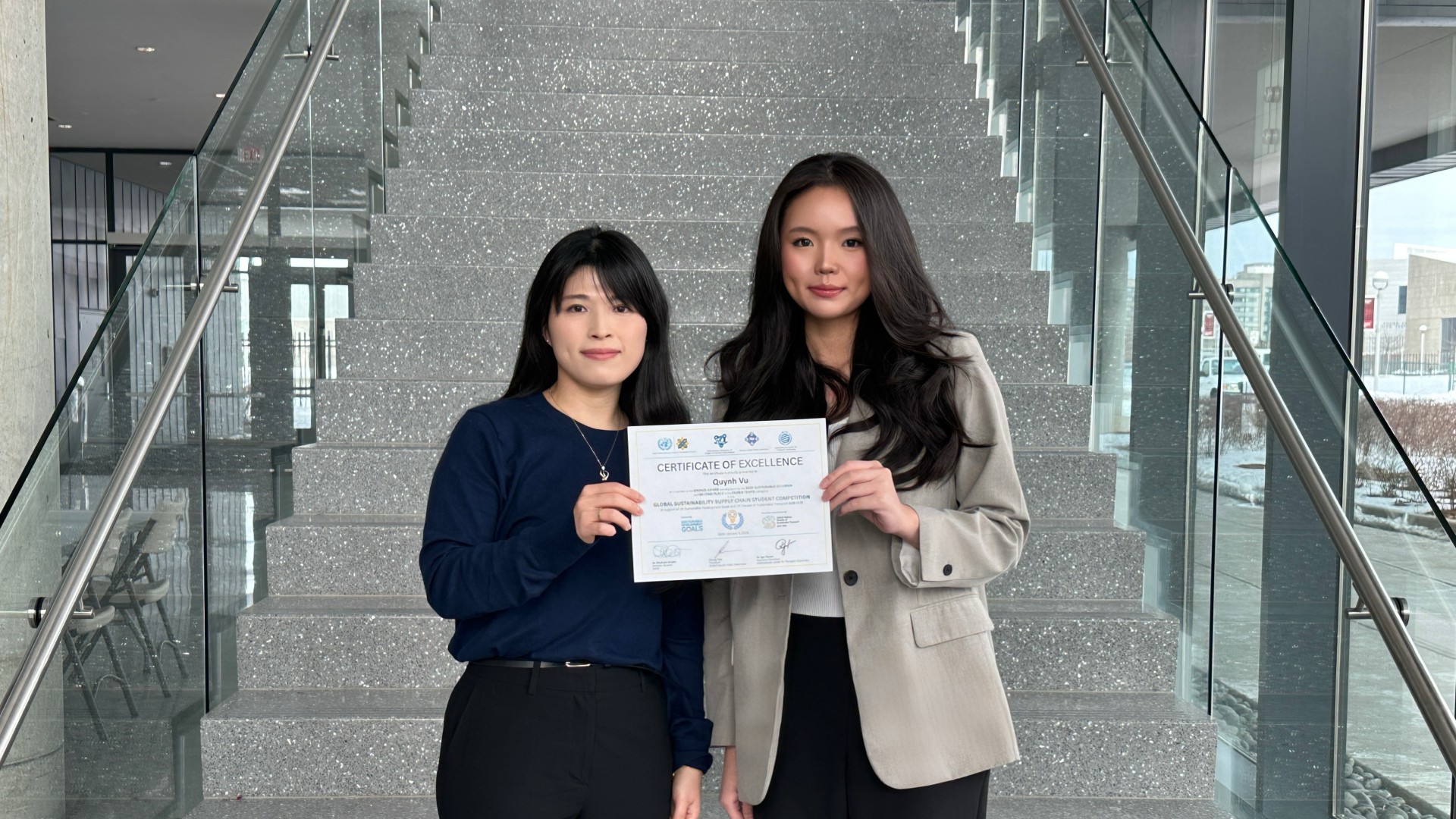 Quynh Vu (right) and Dr. Gawon Jun (left) at Glass Hall.