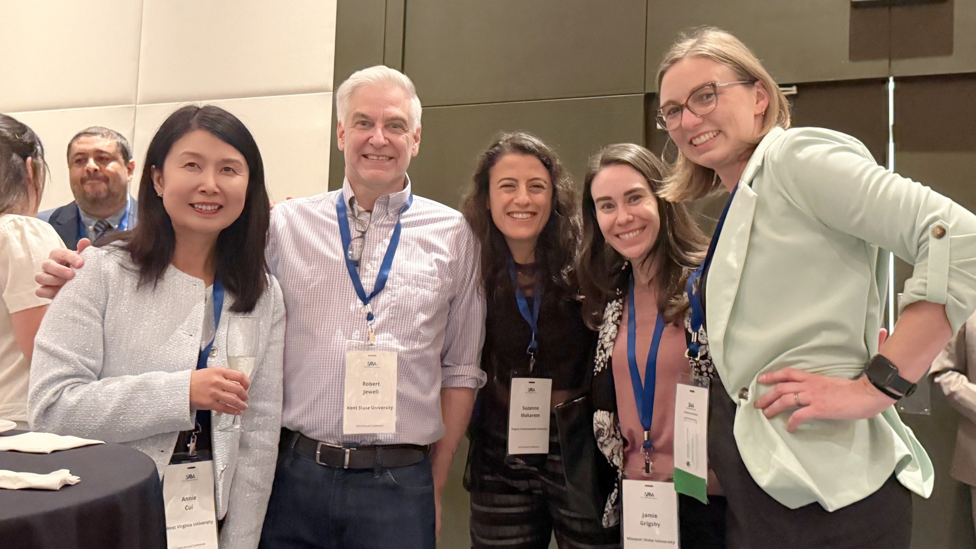 Dr. Jamie Grigsby (second from right) at a conference in Tampa, Florida, in 2024.