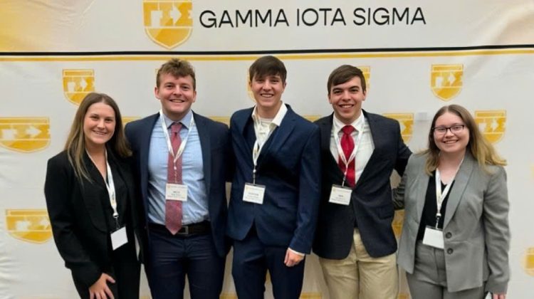 Abigail Staiger (left) and Van McNutt (second from right) at the Gamma Iota Sigma’s 53rd Annual International Conference.