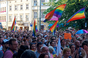 Photo of a LGBTQ solidarity demonstration with people holding pride flags