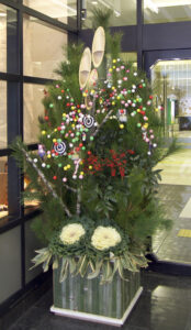 Photo of a kadomatsu. A traditional decoration of plants, flowers and lights for the new year in Japan.
