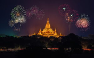 Image of fireworks above a lighted temple