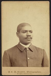 Half-length portrait of an African American soldier; Buffalo soldier in a five button sack coat