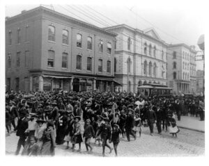 A large crowd walking down the street for Emancipation Day in Richmond, Virginia, 1905.