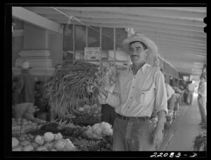 A man holding onions at a Mexican market in Brownsville, Texas