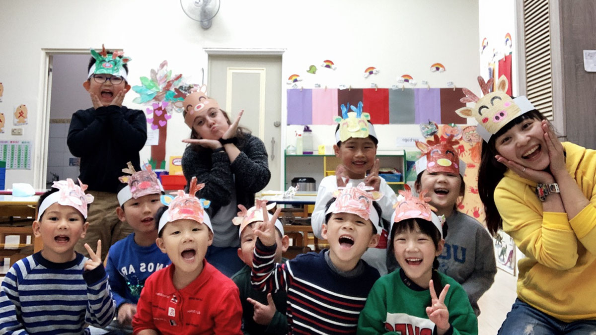 MSU alumna Kayla Gann poses with her students in Taiwan.