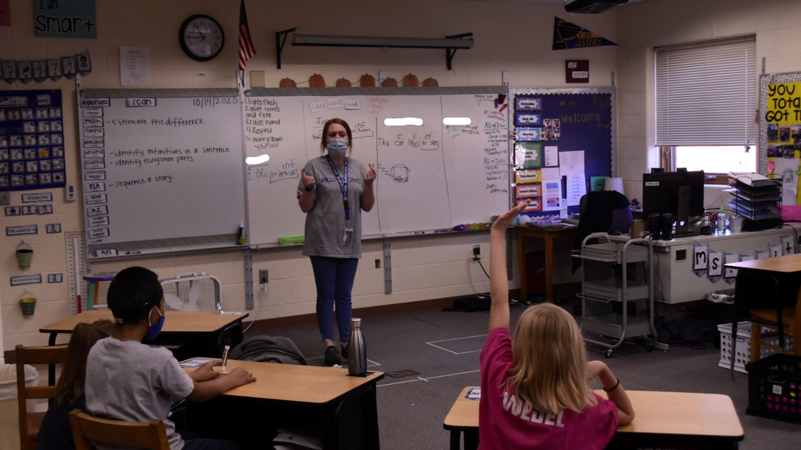 Kaitlin Voss teaches at the front of her classroom at the Kansas School for the Deaf.