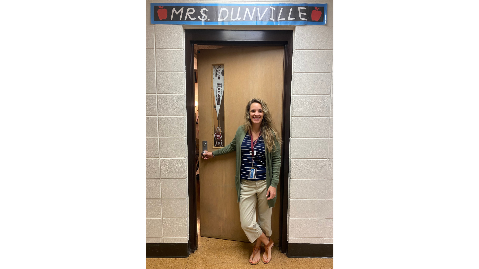 Hannah Dunville in front of her classroom.