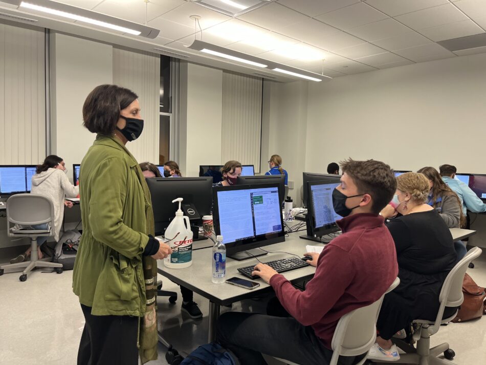 Dr. Etta Madden gives instructions to a class in a computer lab