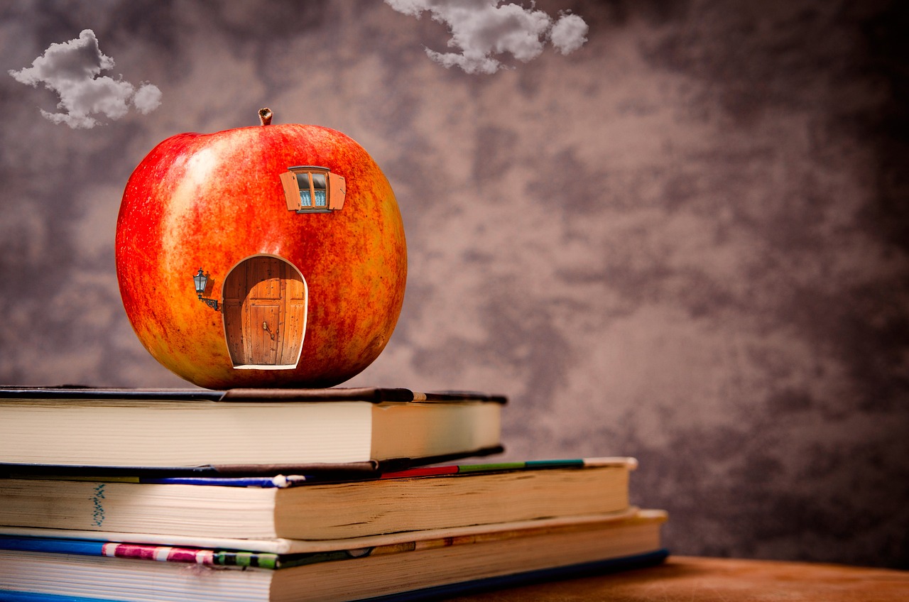 Stack of Books with an apple on the top