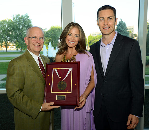 Kim and Patrick Harrington are presented the Founders Medallion by President Clif Smart
