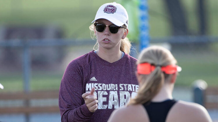 Coach Mallory Weber coachiing a tennis player