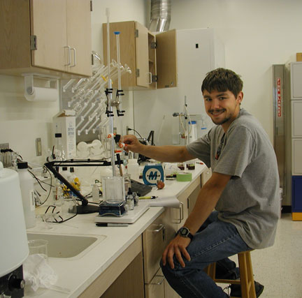 Lucas Snodgrass, Dr. Karl Wilker's graduate student, runs an acid/base titration in order to determine how much acid is present in the grape juice from berry samples collected from the vineyards.