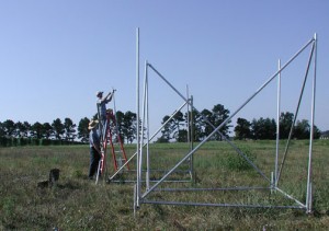 Researchers construct rainfall simulators for their experiment.