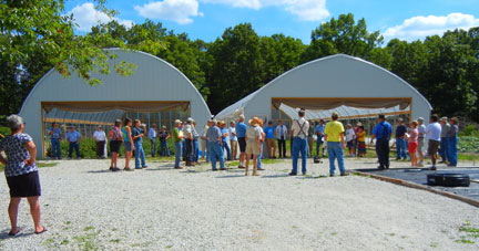Jeff and Tammy Johnston of Sun Crest Farms talk about their high tunnels with the group.