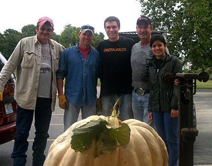 The group that harvested the giant pumpkins is from left to right: Randy Stout, Jeremy Emery, Logan Duncan, C. J. Odneal and Pragya Adhikari. Photo by Leslie Akers.