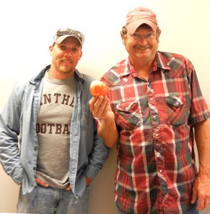 Jeremy (left) and Randy ran the booth for the Mountain Grove Fall Festival giving out apples and horticultural advice.
