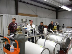 Here is the bottling line crew from left to right: C. J. Odneal, Dr. Karl Wilker, Manny McFall and Avery Crisp.