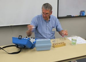 Bob Schultheis, University of Missouri Extension Ag Engineer, begins testing water for chemical composition.