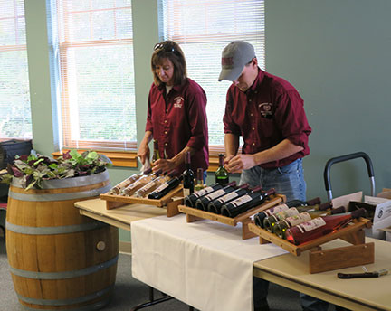 Shelia and Jeremy work on the wine selections.