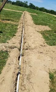 PVC pipe runs down the head of the rows.