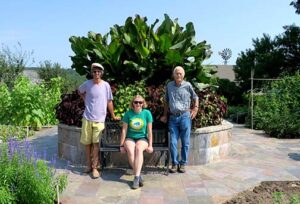 Jerre, Emily and Leroy in the garden in the center of the Pioneer Village.