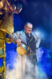 Tom McGowan on stage in a live performance of WICKED